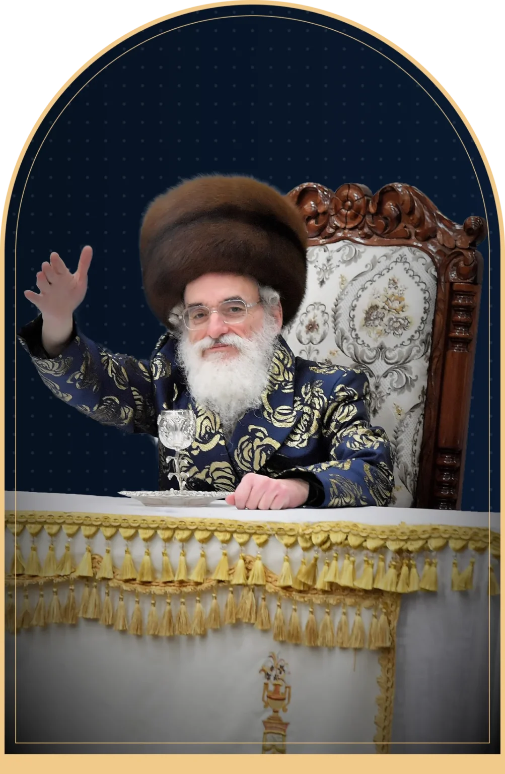 Portrait of the Viznitzer Rebbe seated at his table